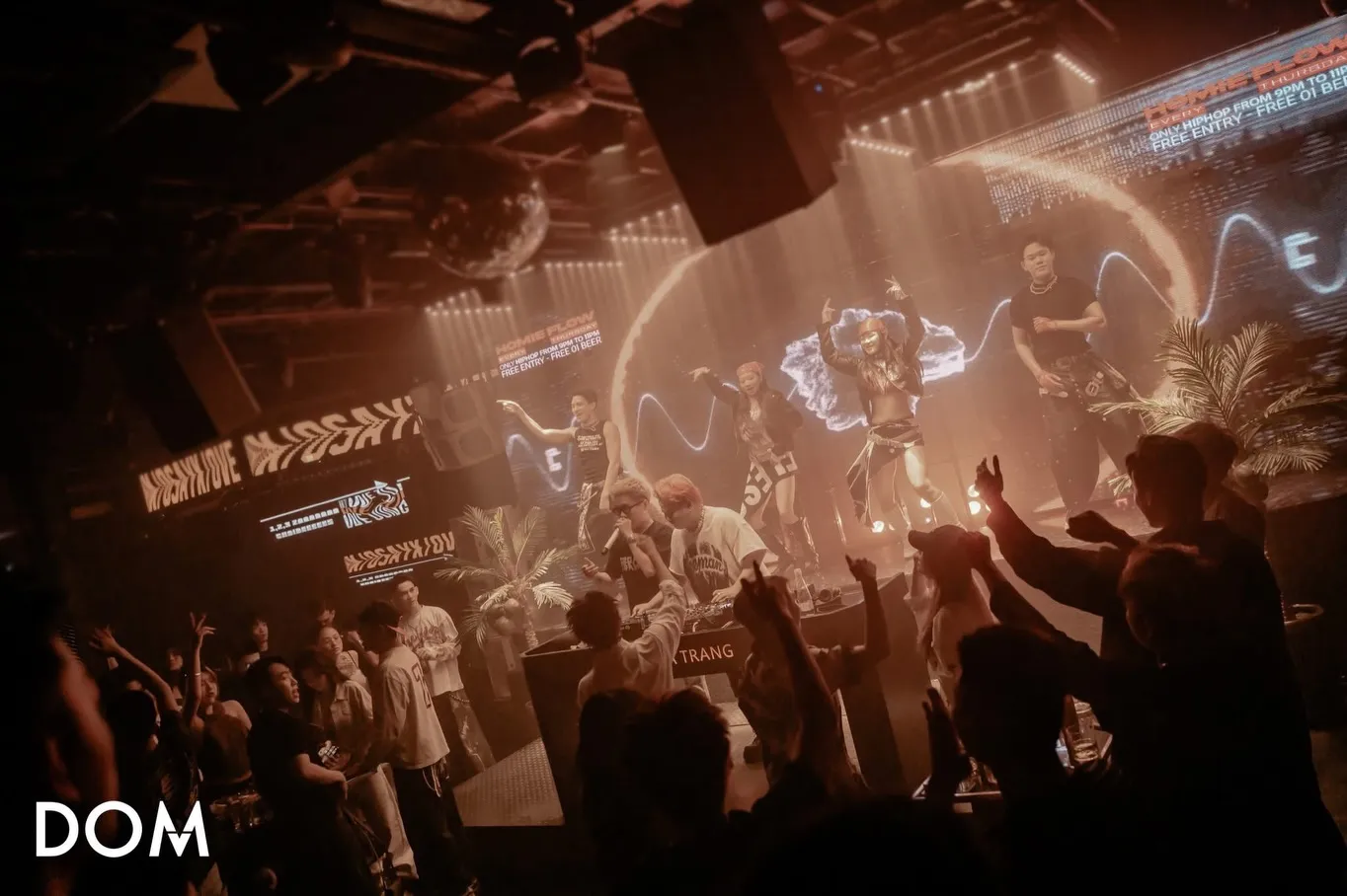 Performers on the DOM stage facing the crowd